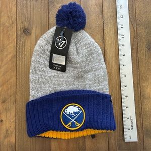 NWT ‘47 Brand Buffalo Sabres Winter Pom Beanie in blue / grey / yellow.